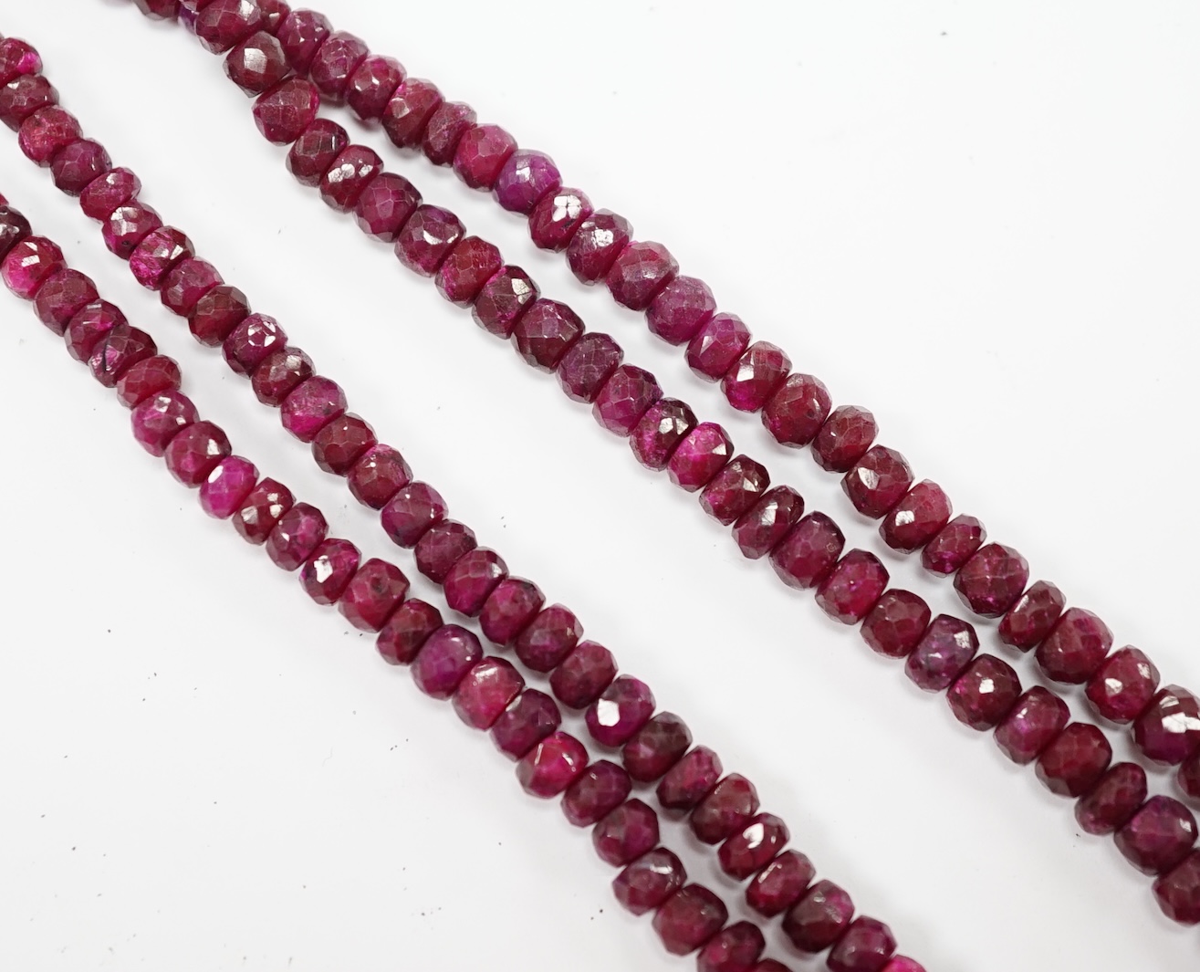 An Indian double strand facetted ruby bead necklace, ruby section only 38cm. Fair condition.